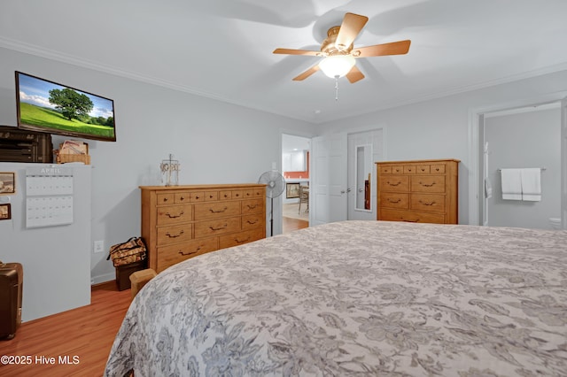 bedroom featuring connected bathroom, ornamental molding, light wood finished floors, and ceiling fan