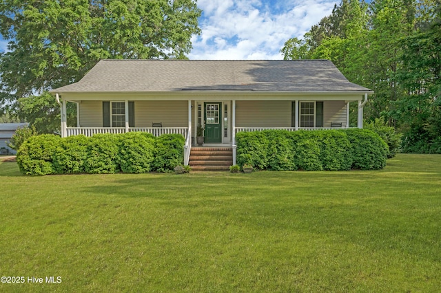 ranch-style house featuring a front lawn and covered porch
