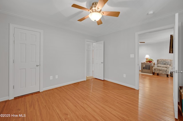 unfurnished bedroom with light wood-style floors, baseboards, and ornamental molding