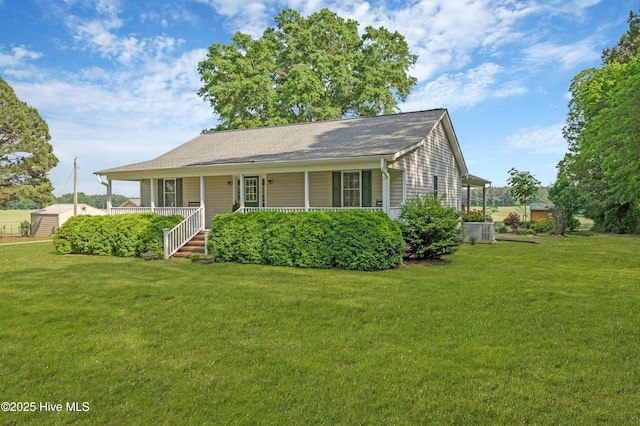 view of front of home with covered porch, central AC, and a front yard
