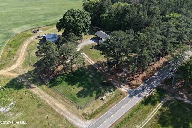 birds eye view of property with a rural view