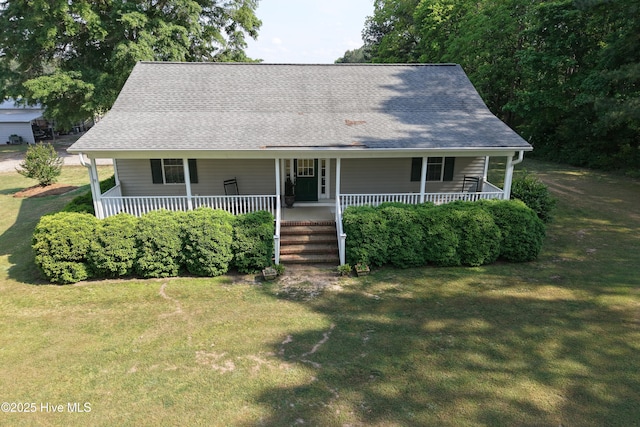 view of front of property with a porch and a front lawn