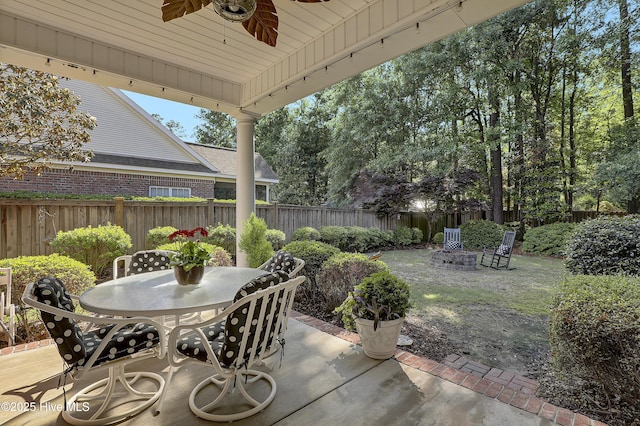 8130 Porters Crossing Way, Wilmington, NC 28411 - view of patio / terrace featuring a ceiling fan, a fenced backyard, and outdoor dining area