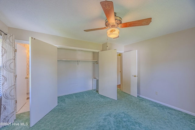 unfurnished bedroom featuring a closet, a ceiling fan, carpet flooring, and a textured ceiling
