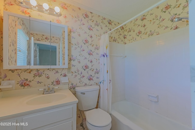 bathroom featuring vanity, toilet, wallpapered walls, and shower / tub combo