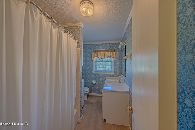 bathroom with a textured ceiling, crown molding, vanity, toilet, and wallpapered walls