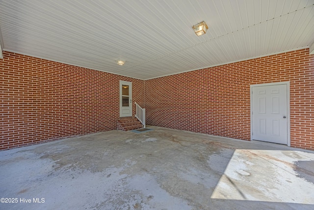view of patio featuring entry steps and an attached carport