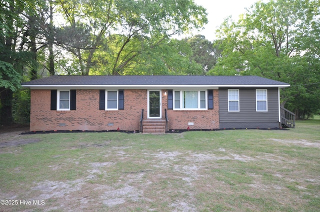 ranch-style house with brick siding, crawl space, entry steps, and a front lawn