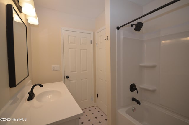 bathroom featuring vanity, tile patterned floors, and tub / shower combination