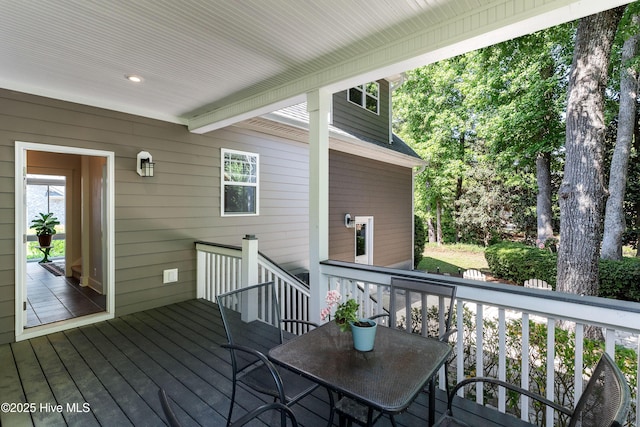 deck with outdoor dining space