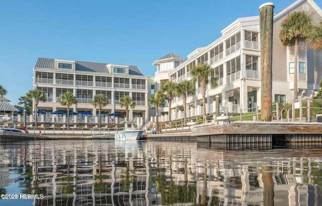 view of apartment building / complex featuring a water view