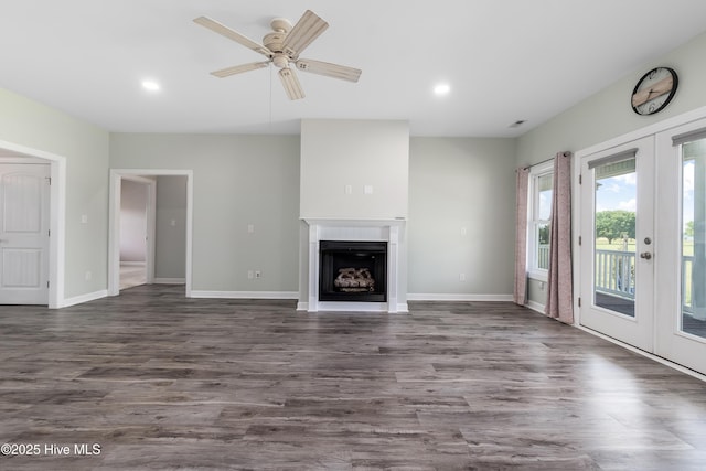 unfurnished living room featuring french doors, recessed lighting, dark wood finished floors, and ceiling fan