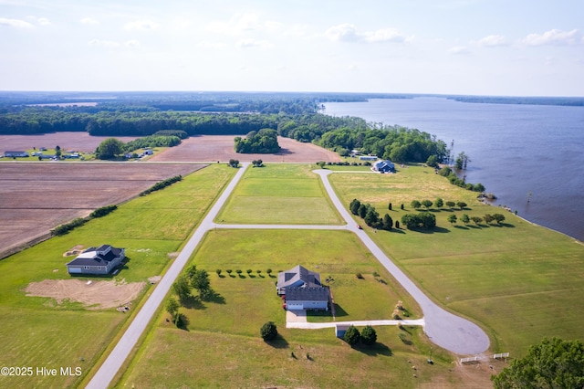 birds eye view of property with a water view and a rural view