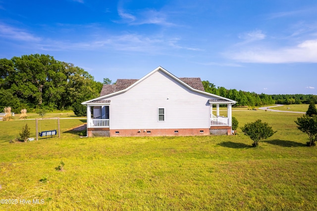 view of property exterior featuring a lawn and crawl space