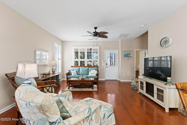 living room with ceiling fan, wood finished floors, and baseboards