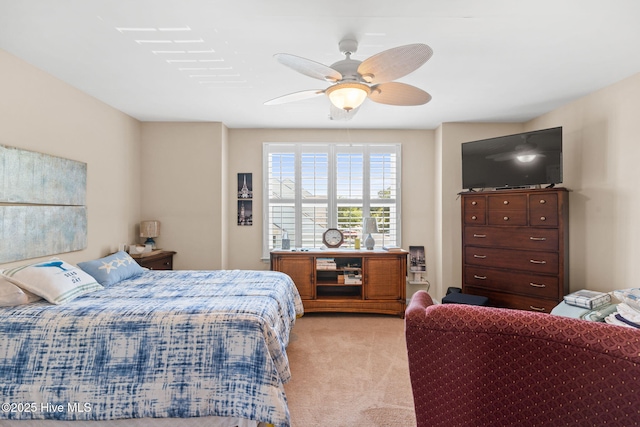 bedroom with light carpet and ceiling fan