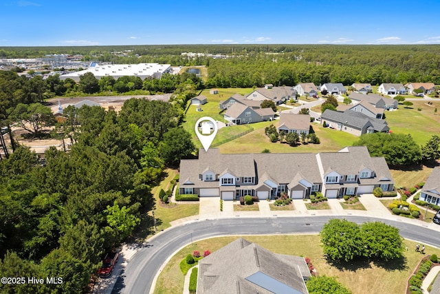 aerial perspective of suburban area with a heavily wooded area