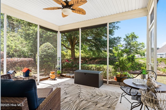 sunroom / solarium featuring ceiling fan