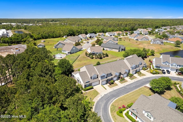 aerial perspective of suburban area featuring a forest