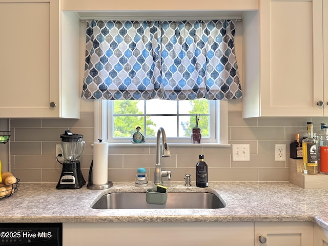 212 Red Carnation Dr, Holly Ridge, NC 28445 - kitchen with a sink, white cabinets, decorative backsplash, dishwasher, and healthy amount of natural light