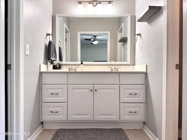 212 Red Carnation Dr, Holly Ridge, NC 28445 - bathroom with tile patterned flooring, double vanity, ceiling fan, and baseboards