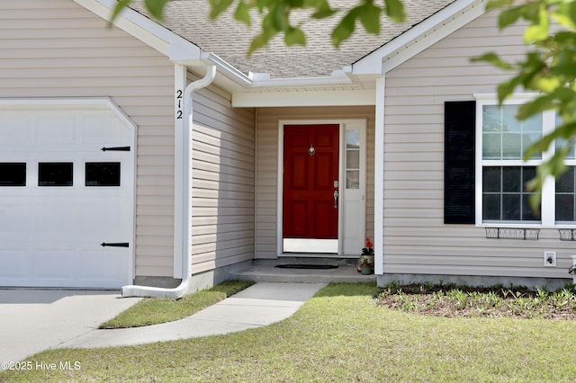 212 Red Carnation Dr, Holly Ridge, NC 28445 - doorway to property featuring an attached garage and roof with shingles