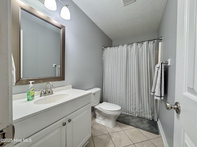 212 Red Carnation Dr, Holly Ridge, NC 28445 - bathroom with toilet, vanity, a textured ceiling, tile patterned floors, and curtained shower