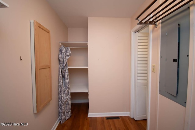 104 Stevens Ct, Swansboro, NC 28584 - walk in closet featuring electric panel, wood finished floors, and visible vents