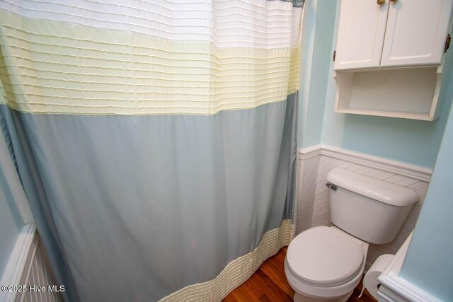 104 Stevens Ct, Swansboro, NC 28584 - bathroom featuring toilet, wainscoting, and wood finished floors