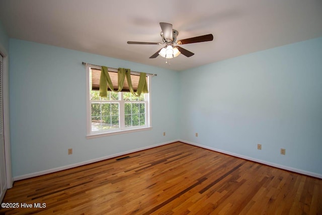 104 Stevens Ct, Swansboro, NC 28584 - spare room featuring baseboards, wood finished floors, and visible vents