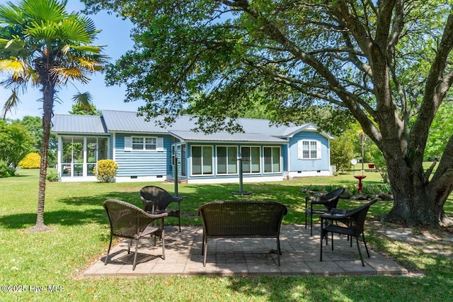 104 Stevens Ct, Swansboro, NC 28584 - back of property with a sunroom, a lawn, and crawl space