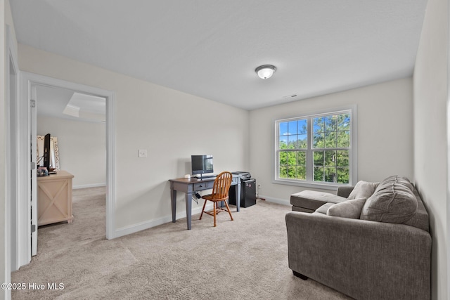 carpeted office featuring baseboards