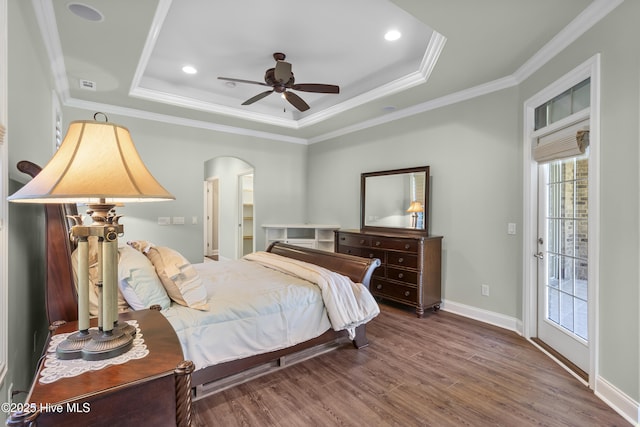 6618 Motts Village Rd, Wilmington, NC 28412 - bedroom with multiple windows, crown molding, wood finished floors, and a raised ceiling