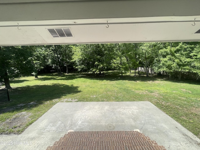view of yard featuring a patio area and visible vents