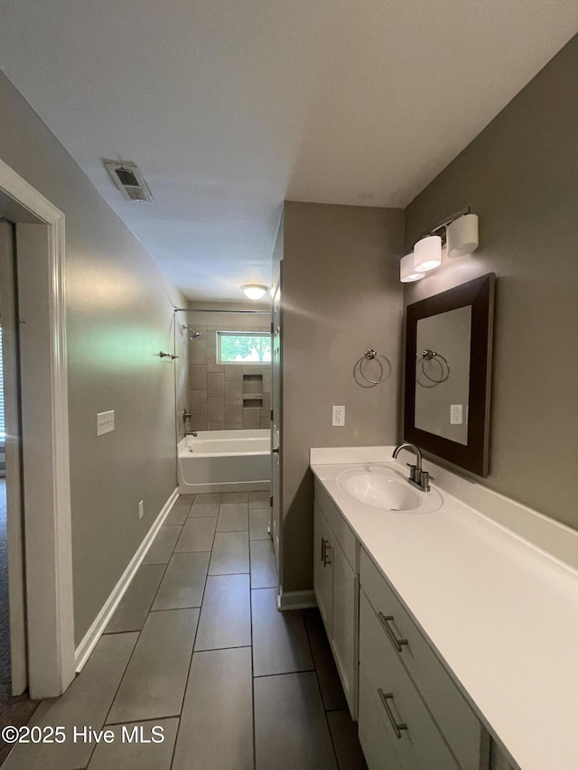 full bath featuring tile patterned flooring, visible vents, vanity, baseboards, and  shower combination