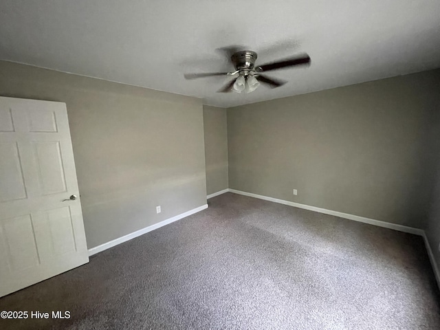 unfurnished room featuring baseboards, a ceiling fan, and dark colored carpet