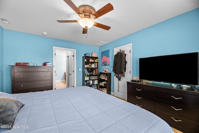 bedroom featuring a ceiling fan, baseboards, and visible vents