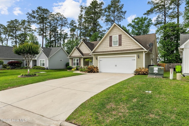 craftsman house with a garage, fence, driveway, and a front yard