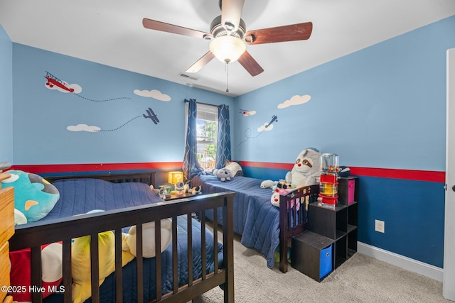 carpeted bedroom featuring a ceiling fan, baseboards, and visible vents
