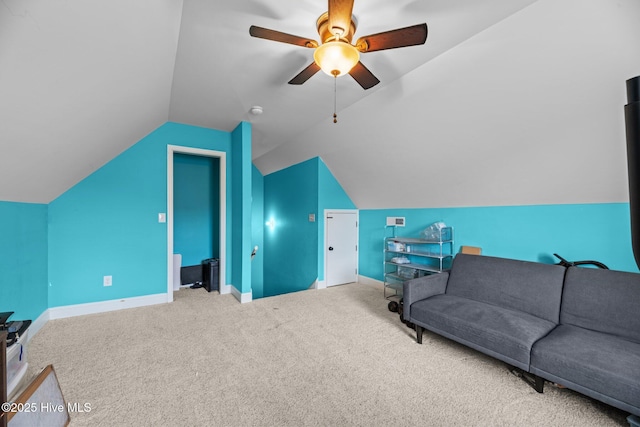 carpeted living room with baseboards, a ceiling fan, and lofted ceiling