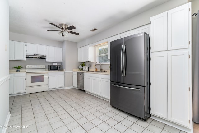 2 Cherokee Dr, Hubert, NC 28539 - kitchen featuring ceiling fan, light countertops, under cabinet range hood, a sink, and appliances with stainless steel finishes