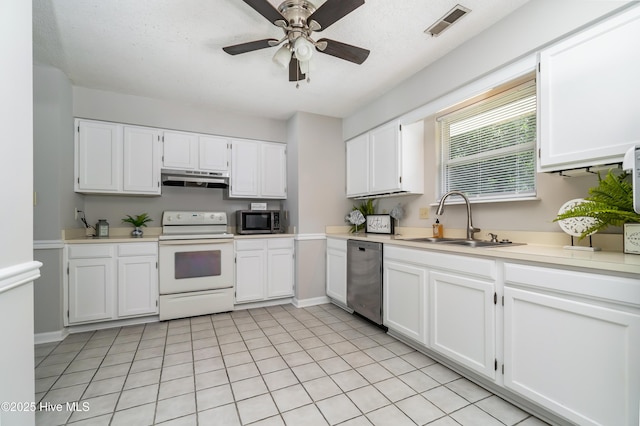 2 Cherokee Dr, Hubert, NC 28539 - kitchen with a sink, under cabinet range hood, white cabinets, and stainless steel appliances