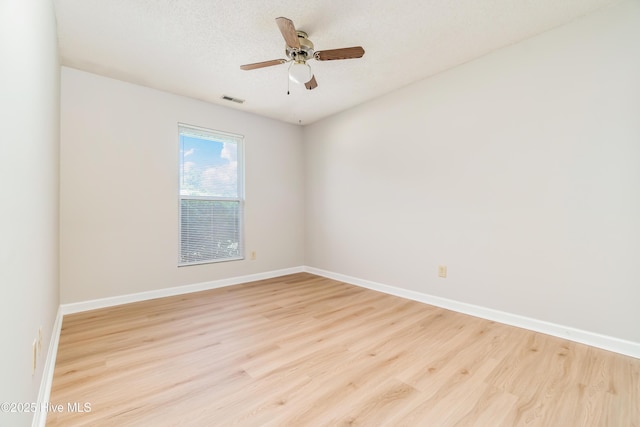 2 Cherokee Dr, Hubert, NC 28539 - empty room with light wood-style floors, baseboards, a ceiling fan, and visible vents