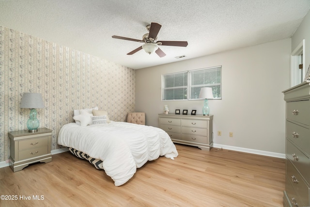 2 Cherokee Dr, Hubert, NC 28539 - bedroom with baseboards, wallpapered walls, light wood-style flooring, and visible vents