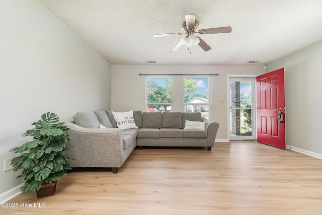 2 Cherokee Dr, Hubert, NC 28539 - living room featuring a textured ceiling, light wood finished floors, and a ceiling fan