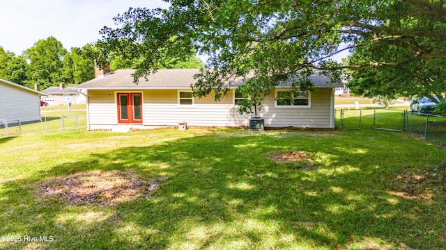 2 Cherokee Dr, Hubert, NC 28539 - rear view of property with a lawn, a fenced backyard, and a chimney