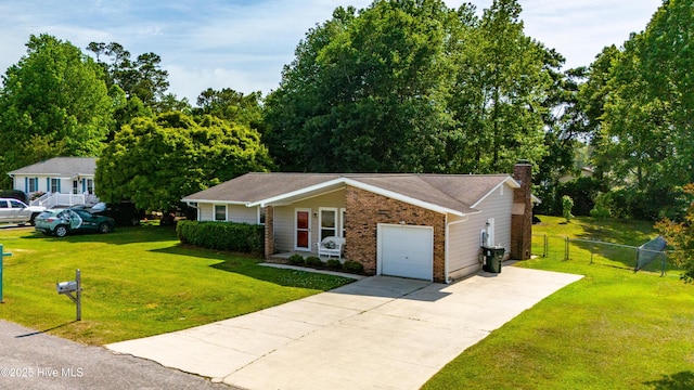 2 Cherokee Dr, Hubert, NC 28539 - ranch-style house featuring a chimney, a front yard, a garage, fence, and concrete driveway