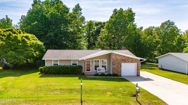 2 Cherokee Dr, Hubert, NC 28539 - view of front facade with driveway, a front yard, and a garage