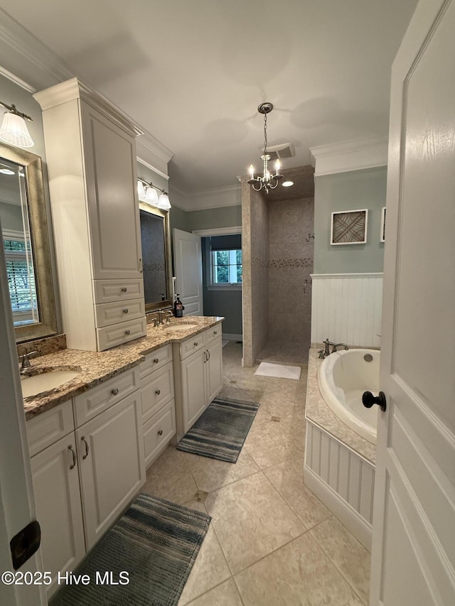 full bathroom with double vanity, visible vents, walk in shower, a sink, and ornamental molding