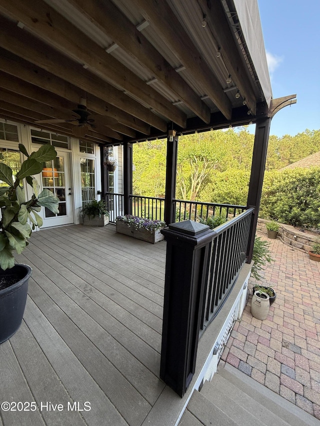 wooden deck featuring ceiling fan